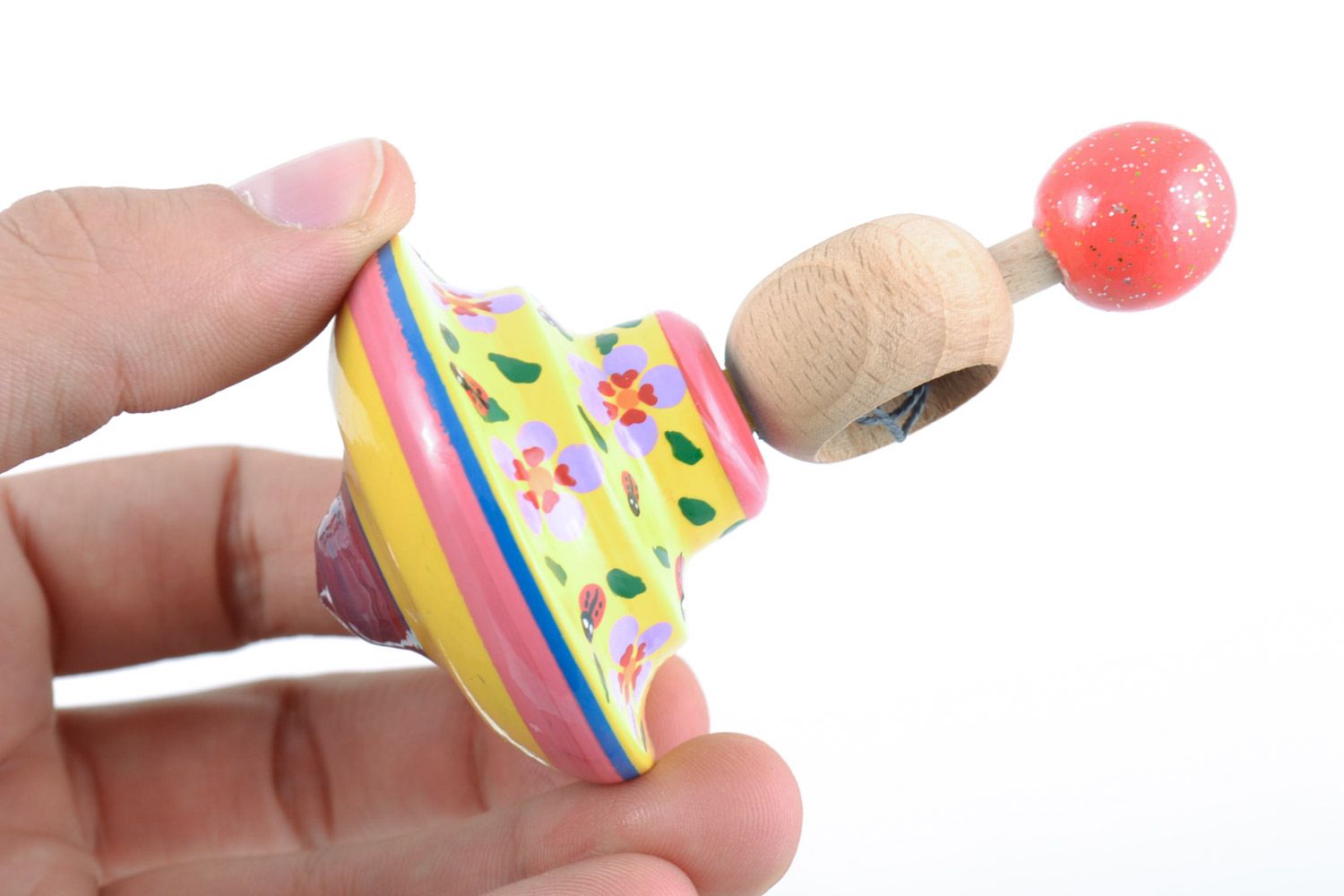 Petite toupie en bois jaune peinte jouet d'activité fait main pour enfant photo 2