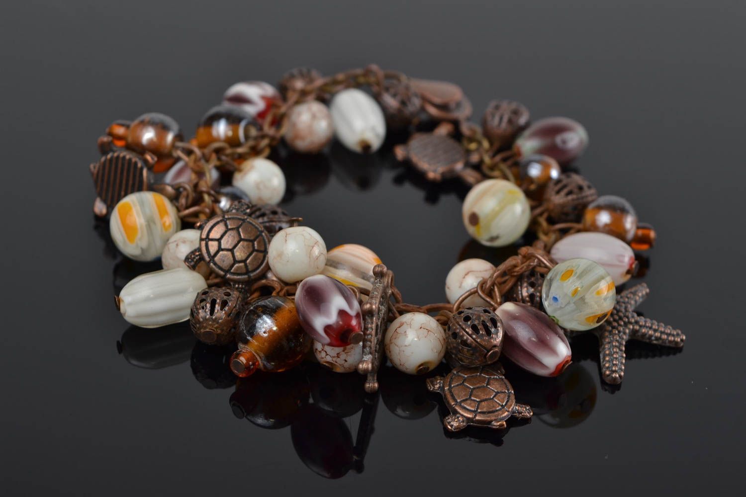 Beautiful handmade wrist bracelet with cat's eye and glass beads in marine style photo 2