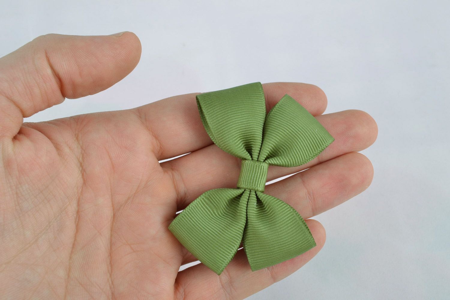 Small handmade rep ribbon bow of green color for creation of accessories photo 2