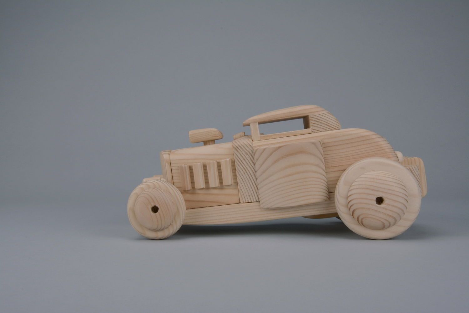 Toy car carved by hand of wood photo 1