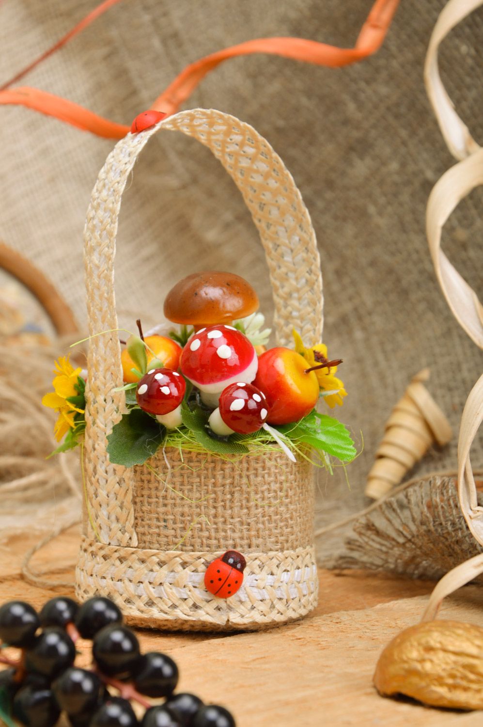Small handmade decorative basket with mushrooms and fruit interior composition photo 1