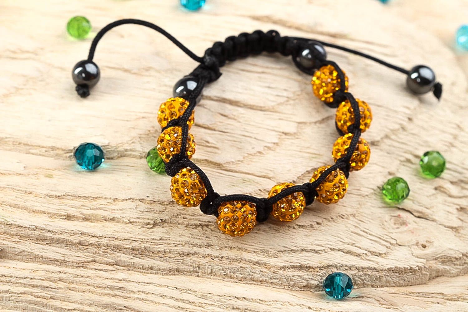 Gold color beads bracelet on the black rope for women photo 1