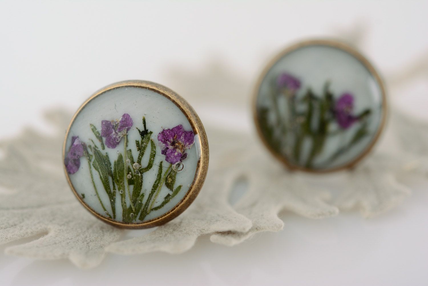 Handmade round stud earrings with tender floral composition in epoxy resin photo 1