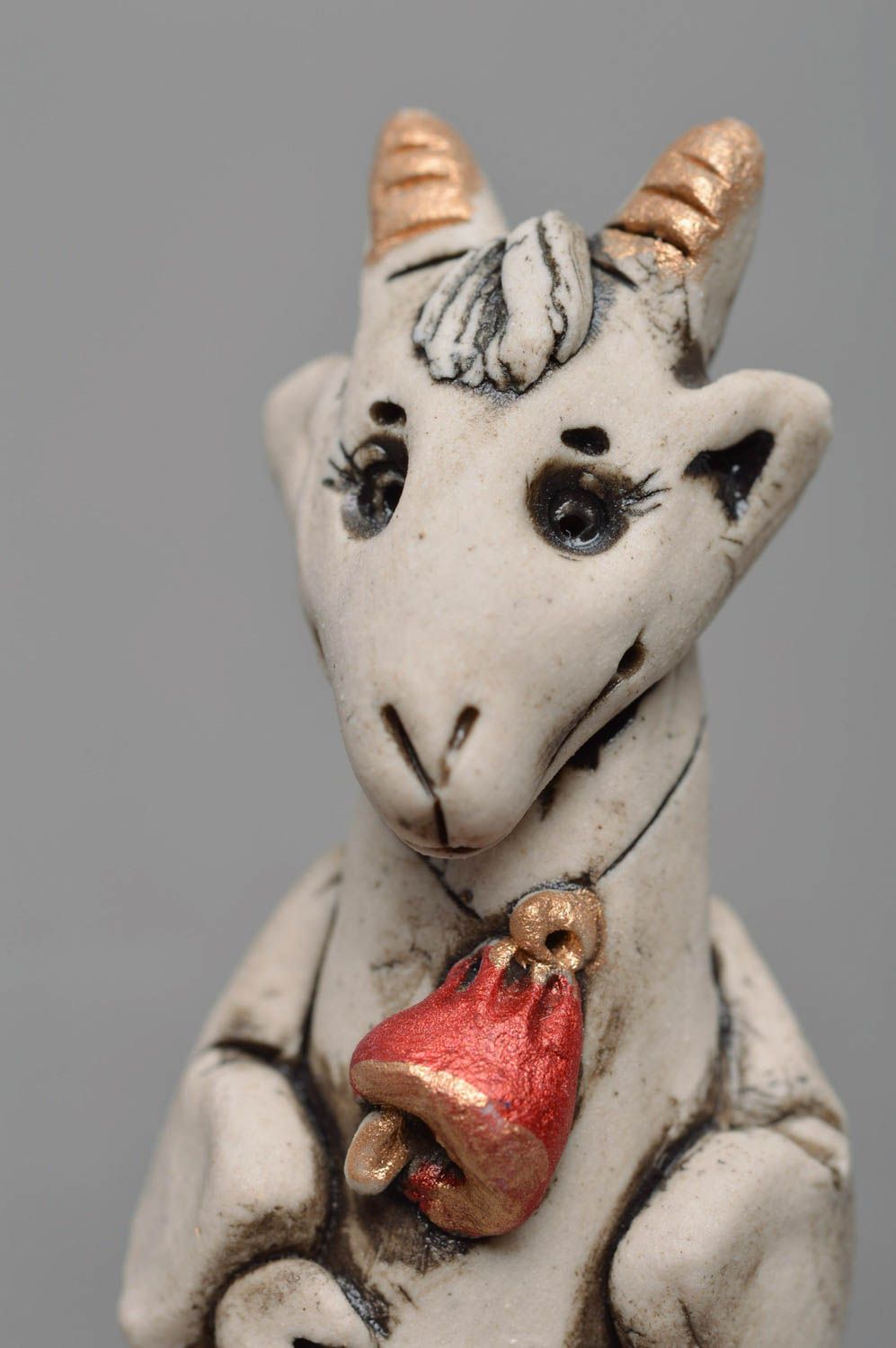 Handmade designer small white glazed porcelain figurine of goat with red bell photo 2