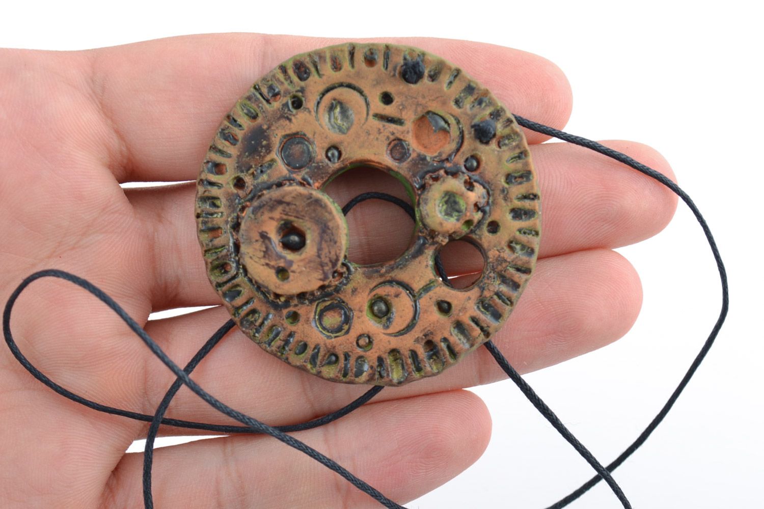 Handmade painted ceramic pendant in the shape of round clock mechanism on cord photo 3
