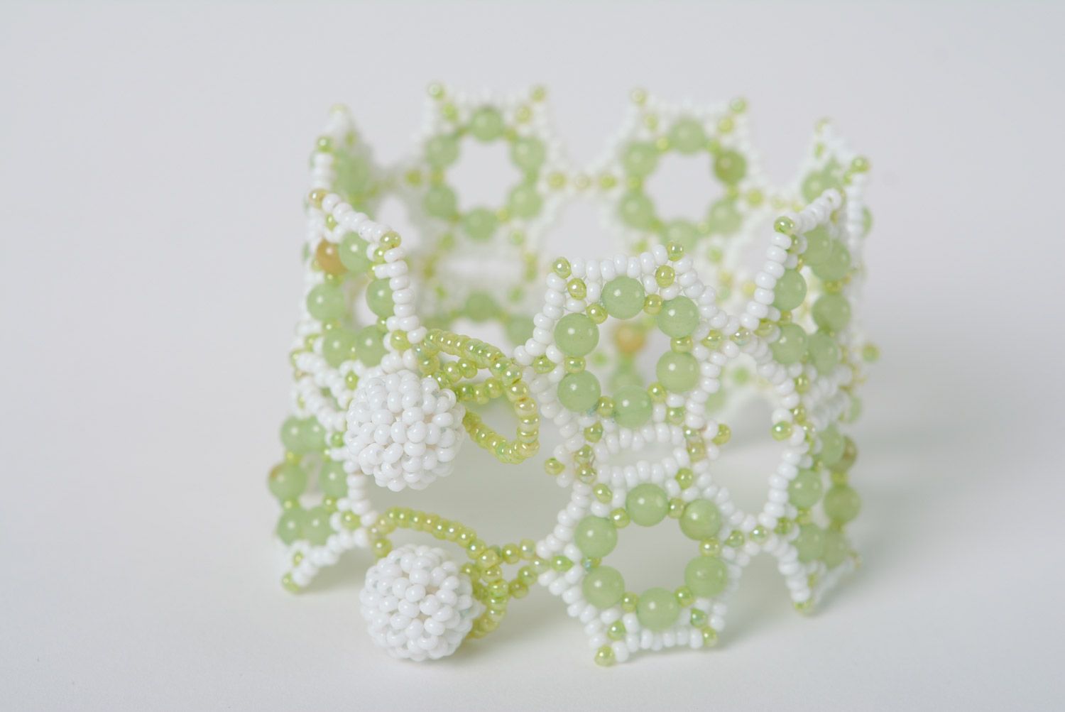 Tender wide handmade lacy wrist bracelet woven of white and light green beads photo 4