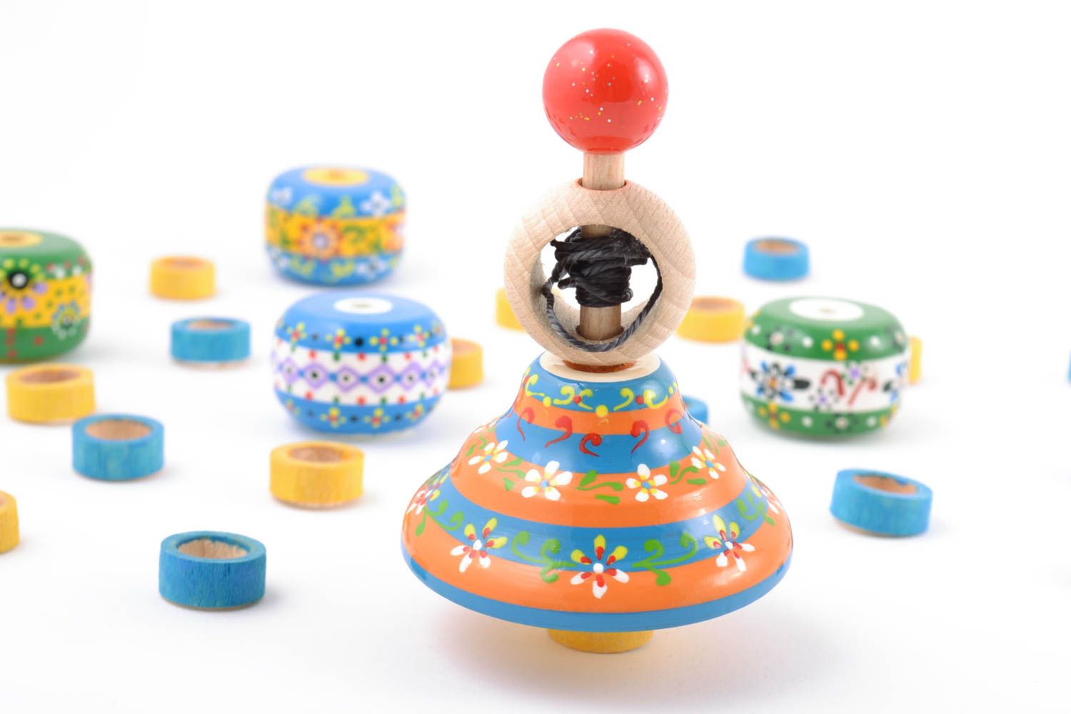 Striped painted eco wooden spinning top with ring and string handmade toy photo 1