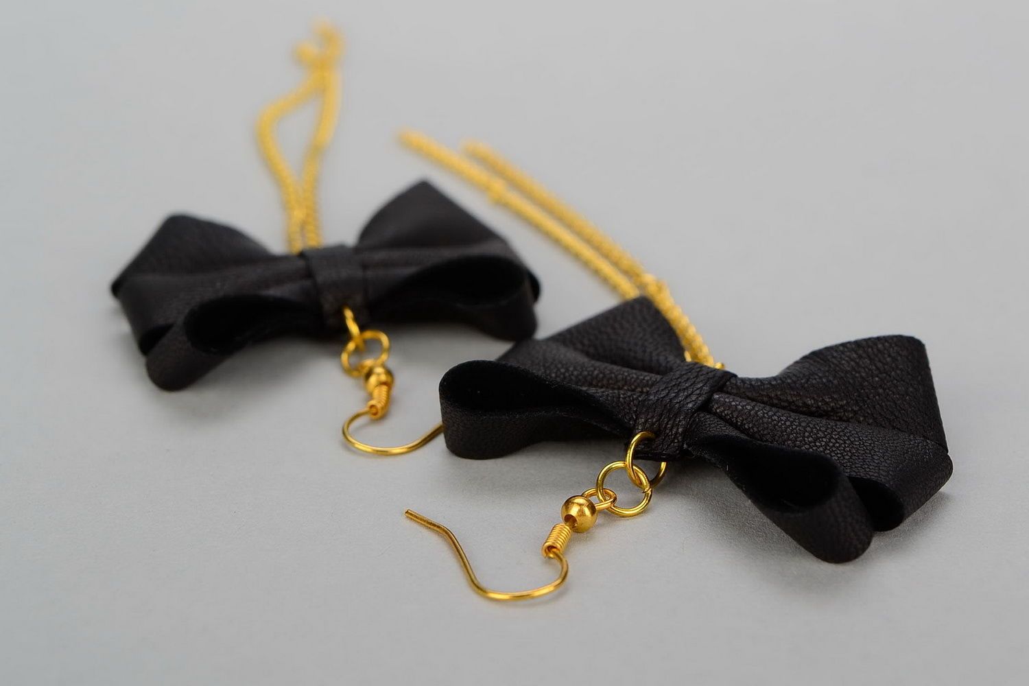 Leather earrings with gilt metal Bows photo 4