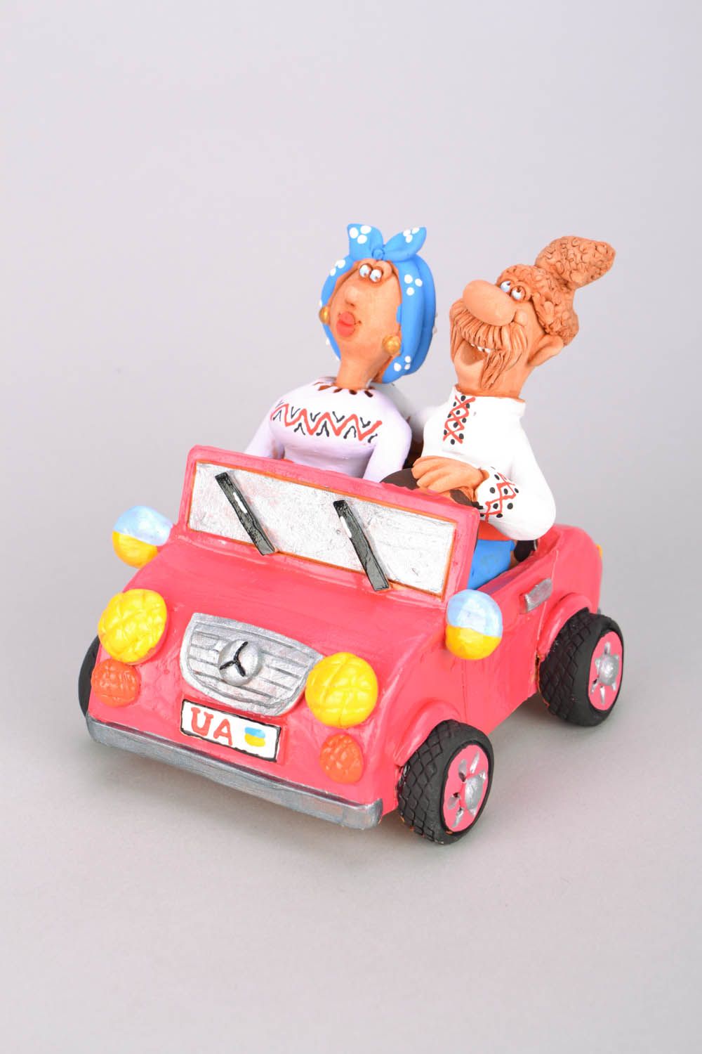 Clay figurine Cossack and his Wife in a Car photo 1