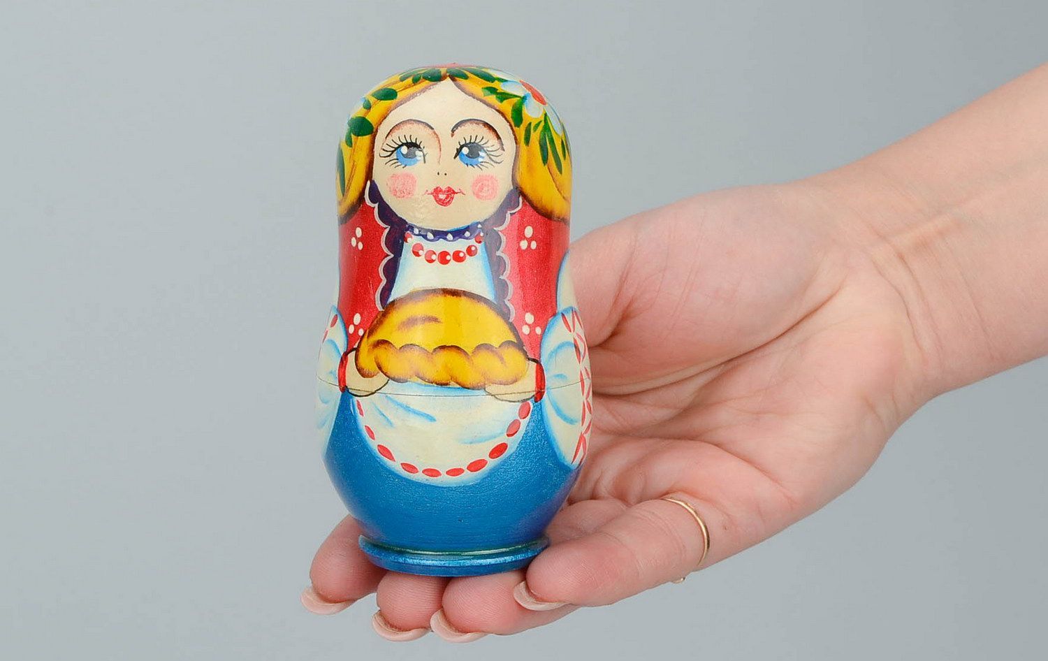 Wooden matryoshka doll with loaf photo 5