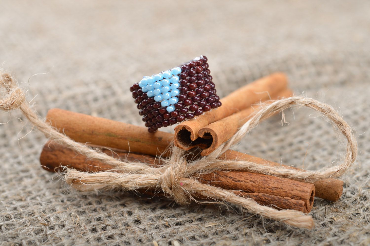Laconic broad handmade ring woven of brads of brown and blue colors for women photo 1