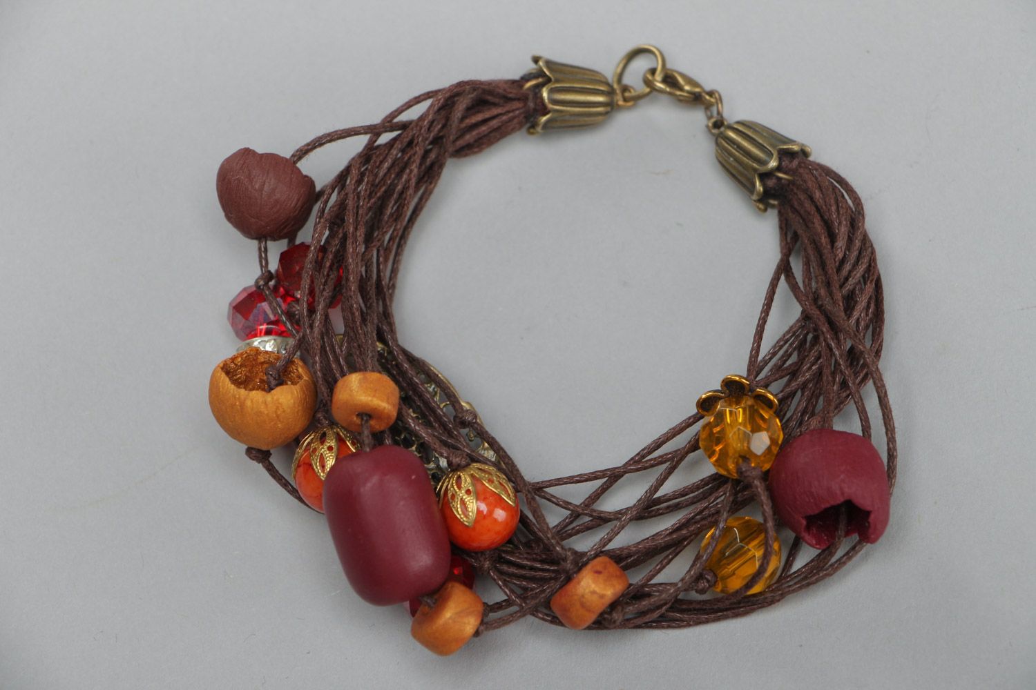 Handmade designer beautiful wrist bracelet made of polymer clay in brown colors photo 1