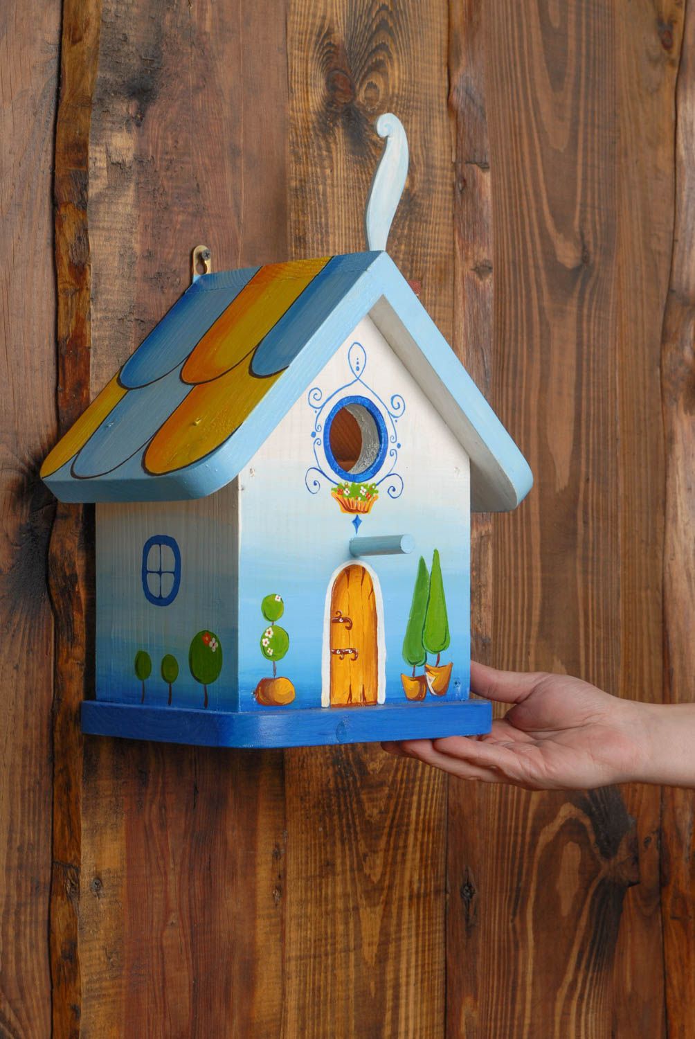 Handmade painted wooden birdhouse in the shape of forest house photo 2