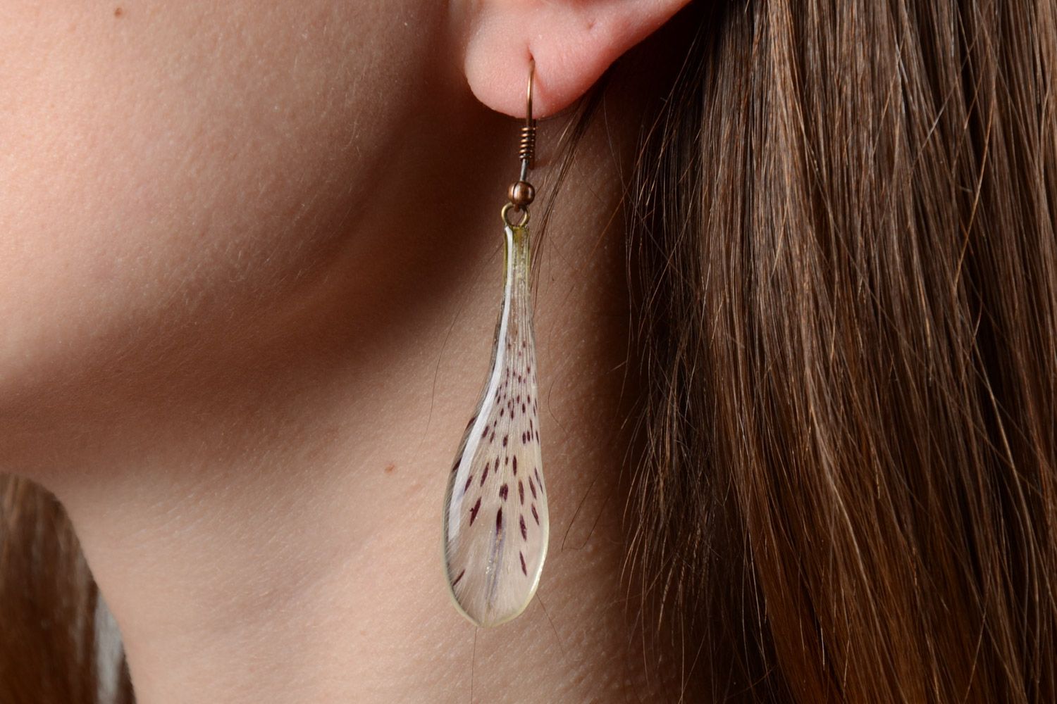 Handmade tender drop-shaped dangling earrings with natural flowers in epoxy resin photo 5