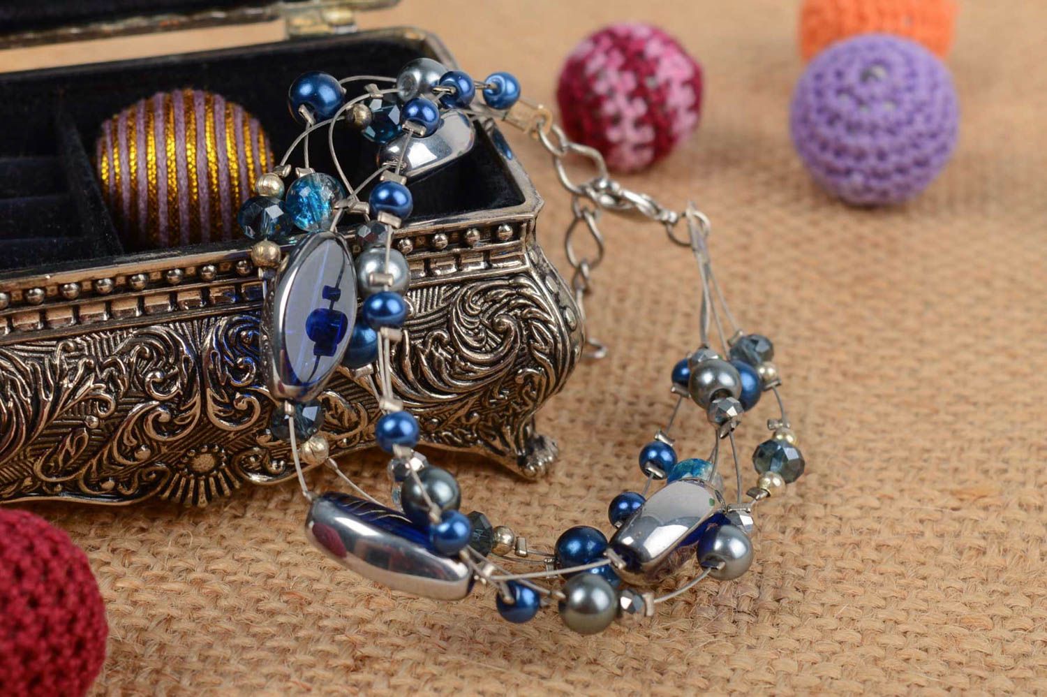Handmade designer wrist bracelet with dark blue ceramic pearls and crystal beads photo 1