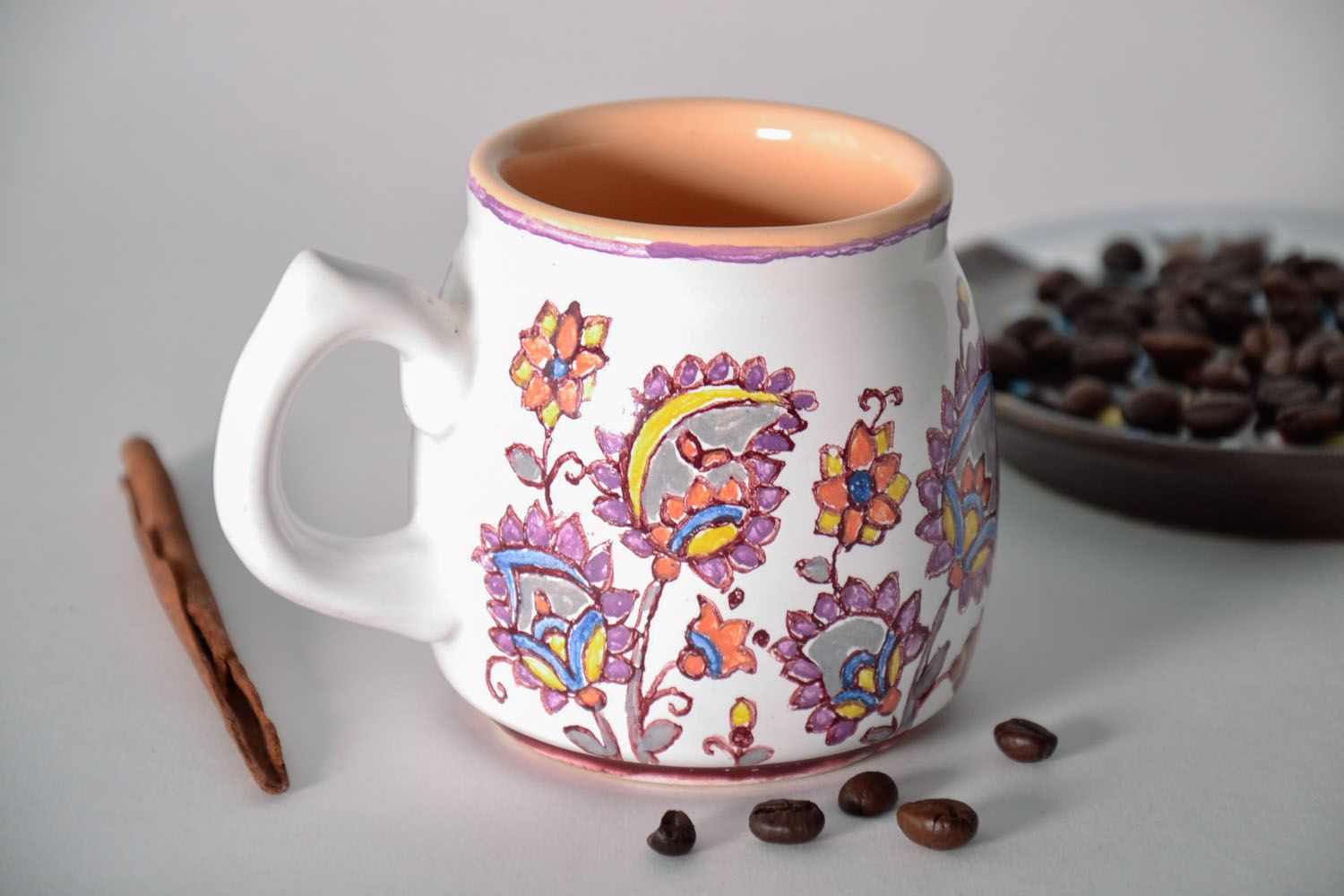 Ceramic coffee cup glazed in white and cherry color with flower pattern and handle photo 1