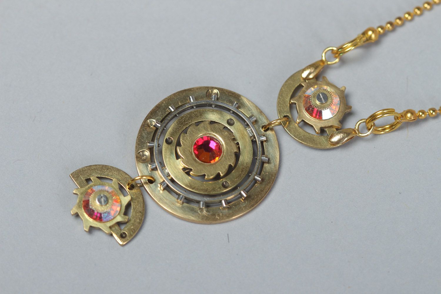 Handmade round steampunk pendant with rhinestones and clock mechanism details photo 2