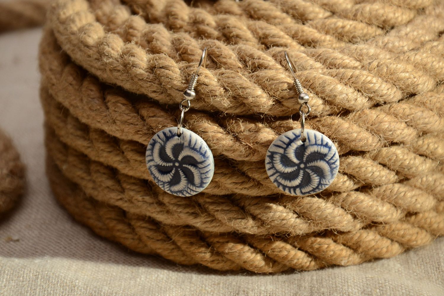 White and blue handmade clay round earrings with charms photo 1