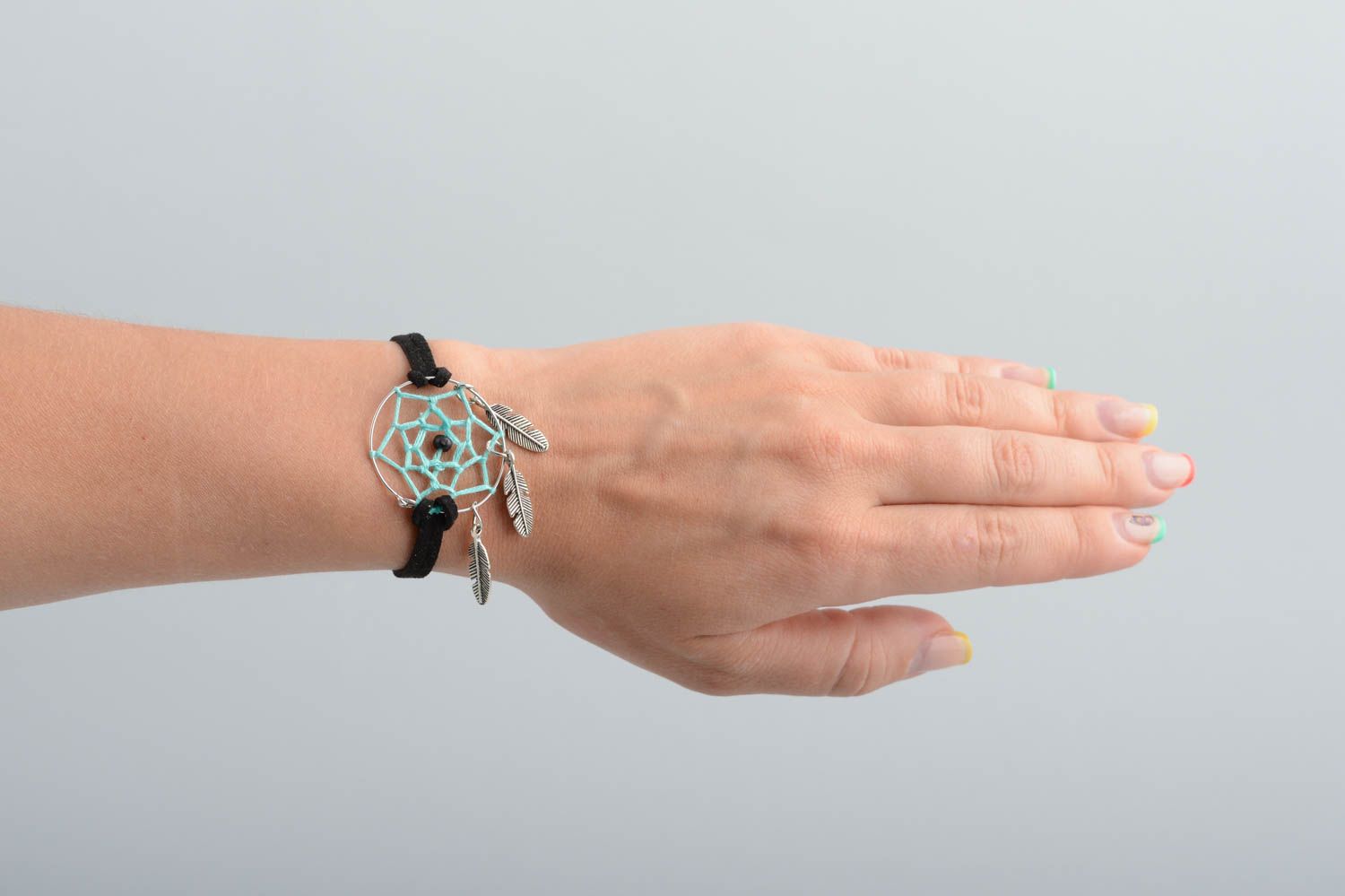Handmade black suede cord wrist bracelet with dreamcatcher and metal feathers photo 5