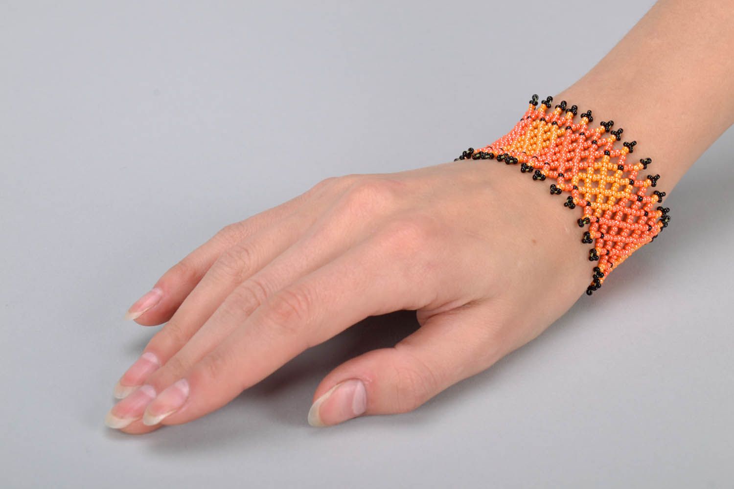 Black and orange beaded bracelet photo 5