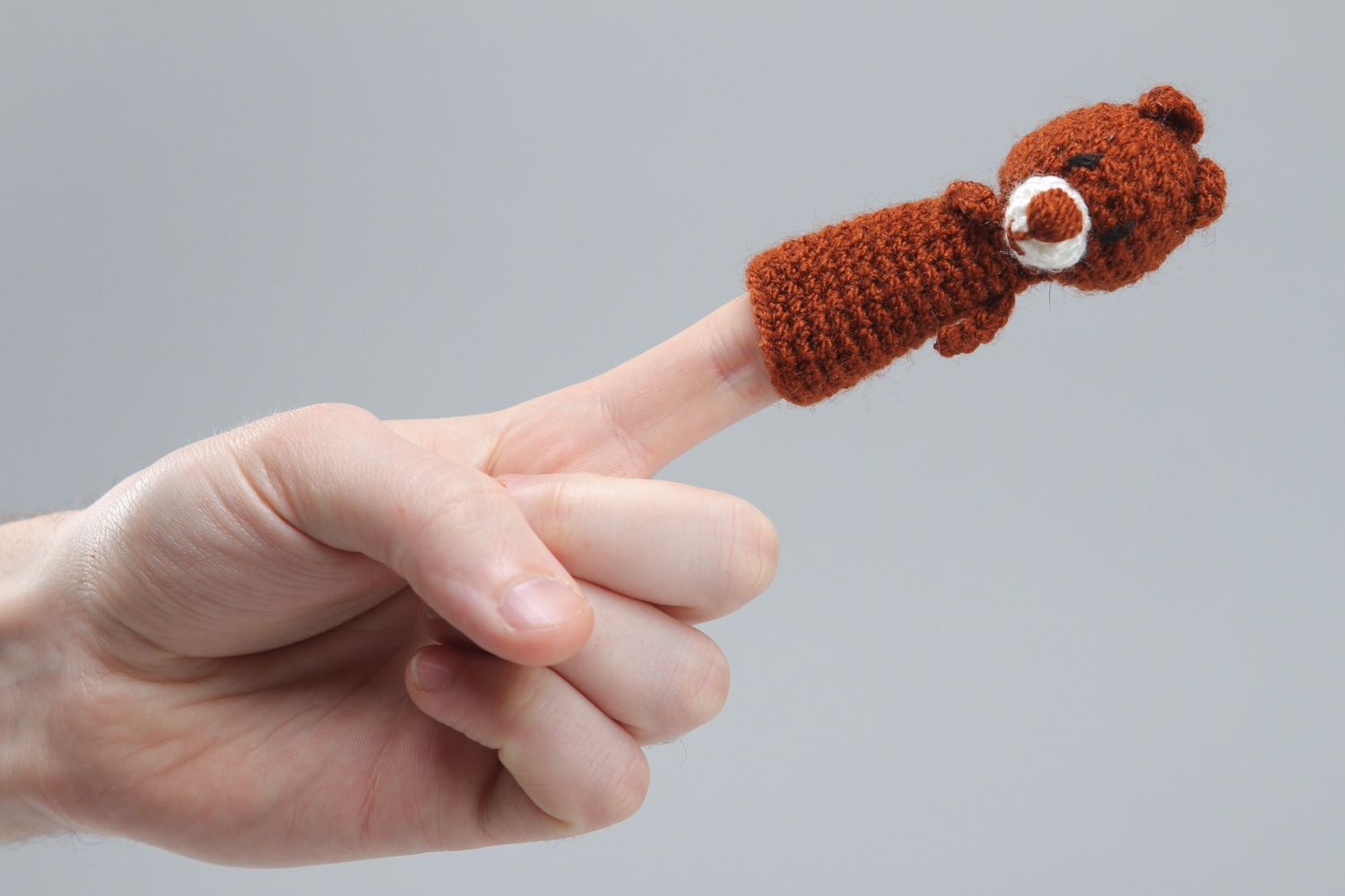 Handmade finger puppet in the shape of brown bear crocheted of acrylic threads photo 4