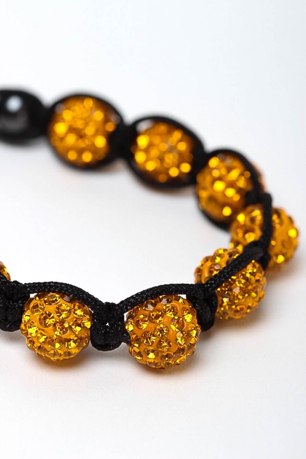 Gold color beads bracelet on the black rope for women photo 3