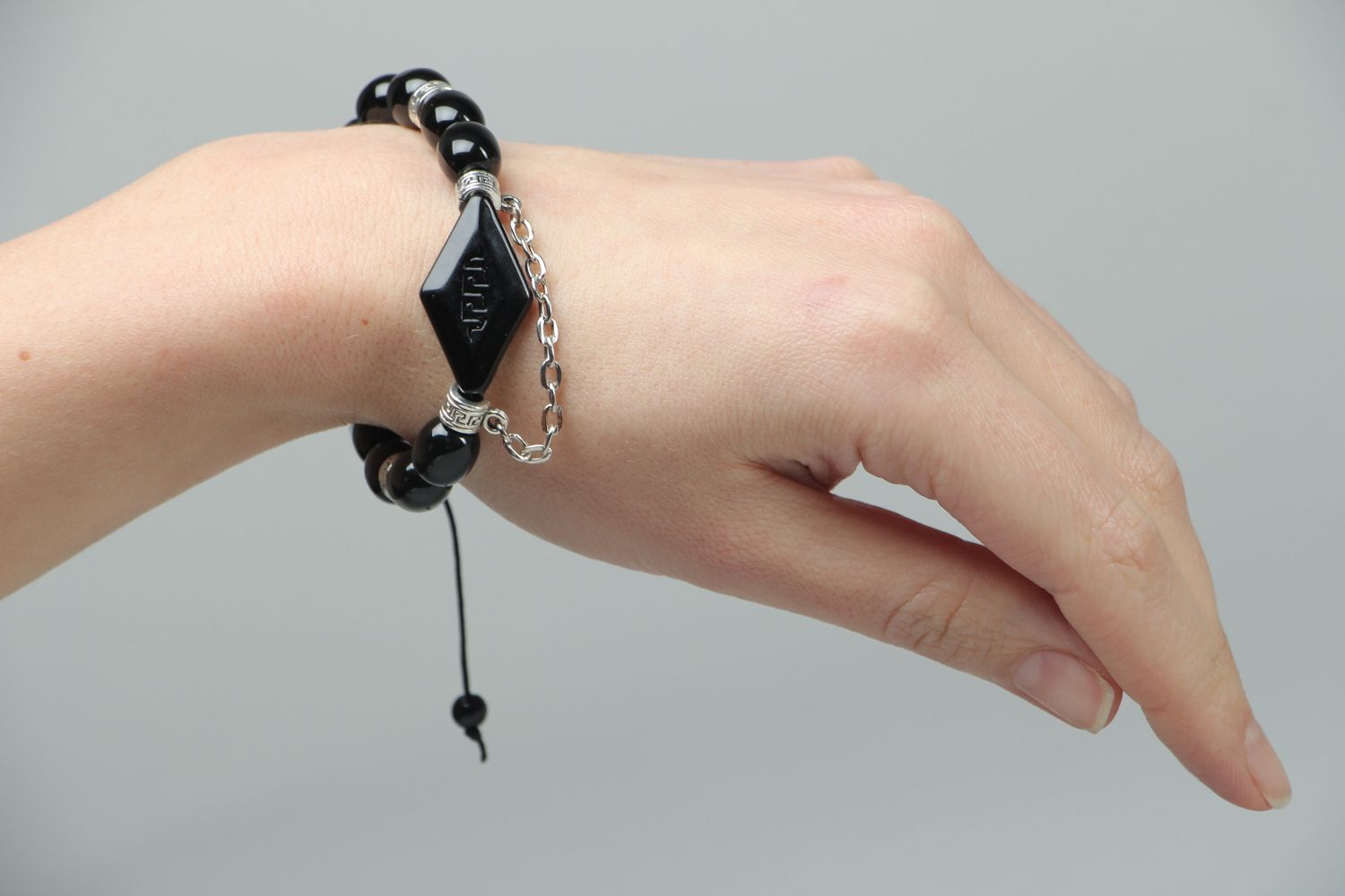 Woven bracelet with black beads photo 3