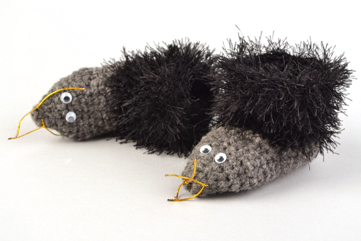 Handmade crochet baby shoes in the shape of gray hedgehogs with black edges photo 1