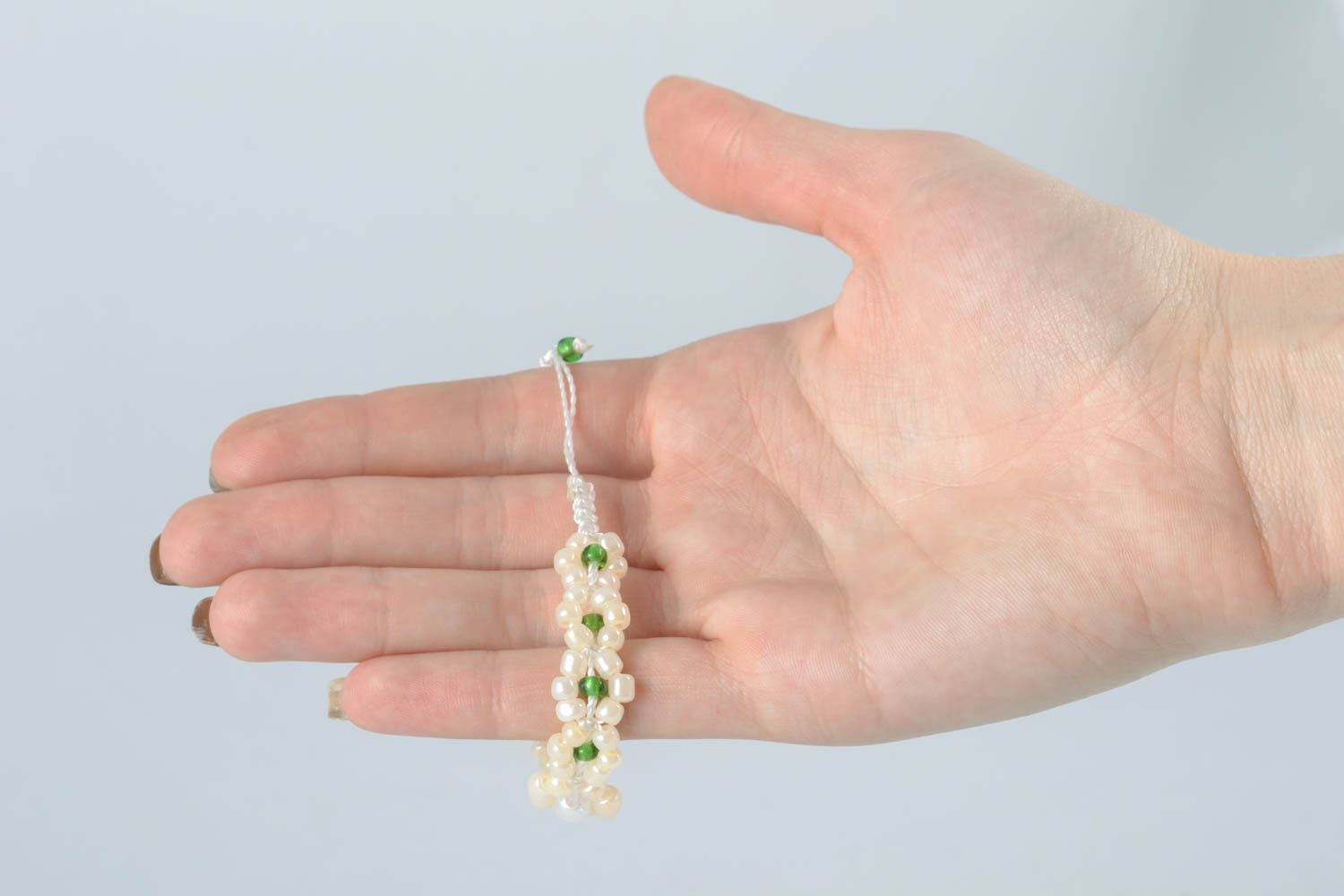 Handmade white and light green beads' white cord strand bracelet photo 4