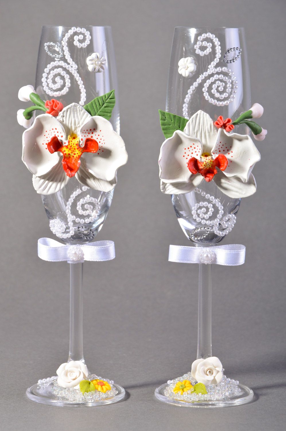 Set of handmade wedding wine glasses of white color with polymer clay orchids 2 items photo 2