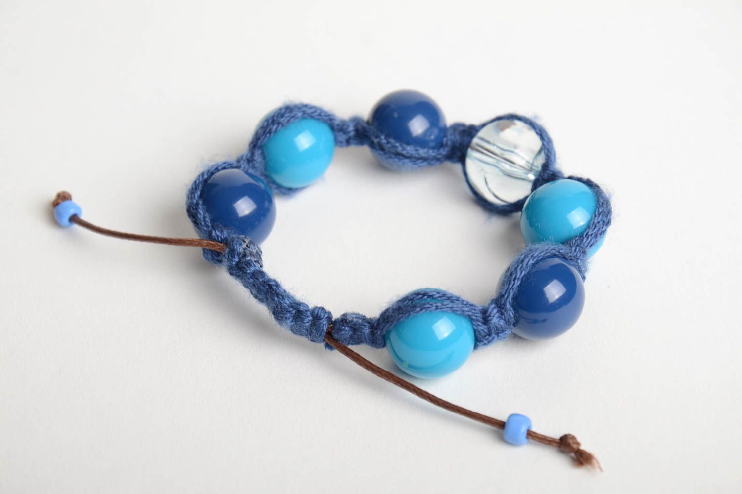 Handmade wrist bracelet crocheted of cord and plastic beads in blue color shades photo 5