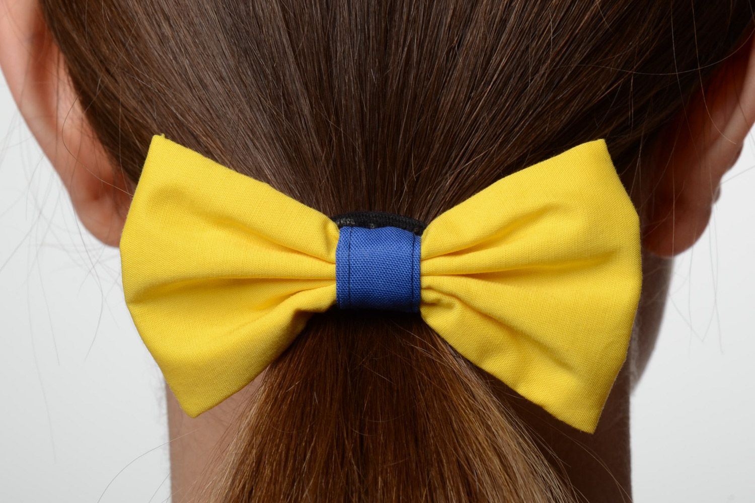 Handmade cotton fabric bow hair tie of yellow and blue colors photo 1