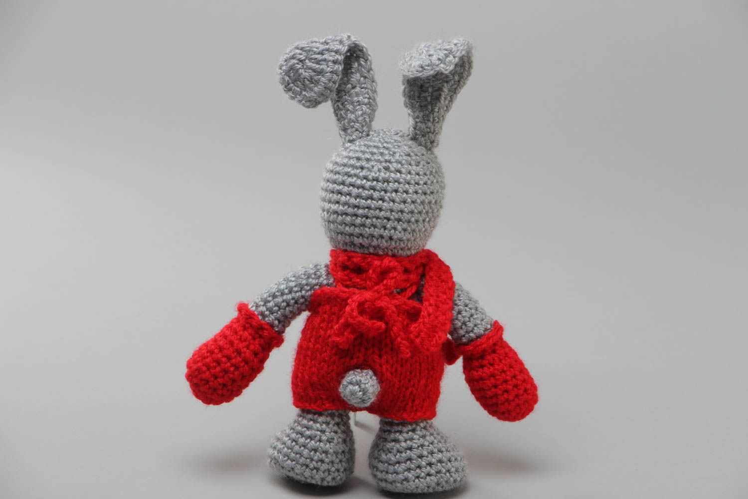 Handmade soft toy gray rabbit crocheted of acrylic threads with red scarf  photo 4