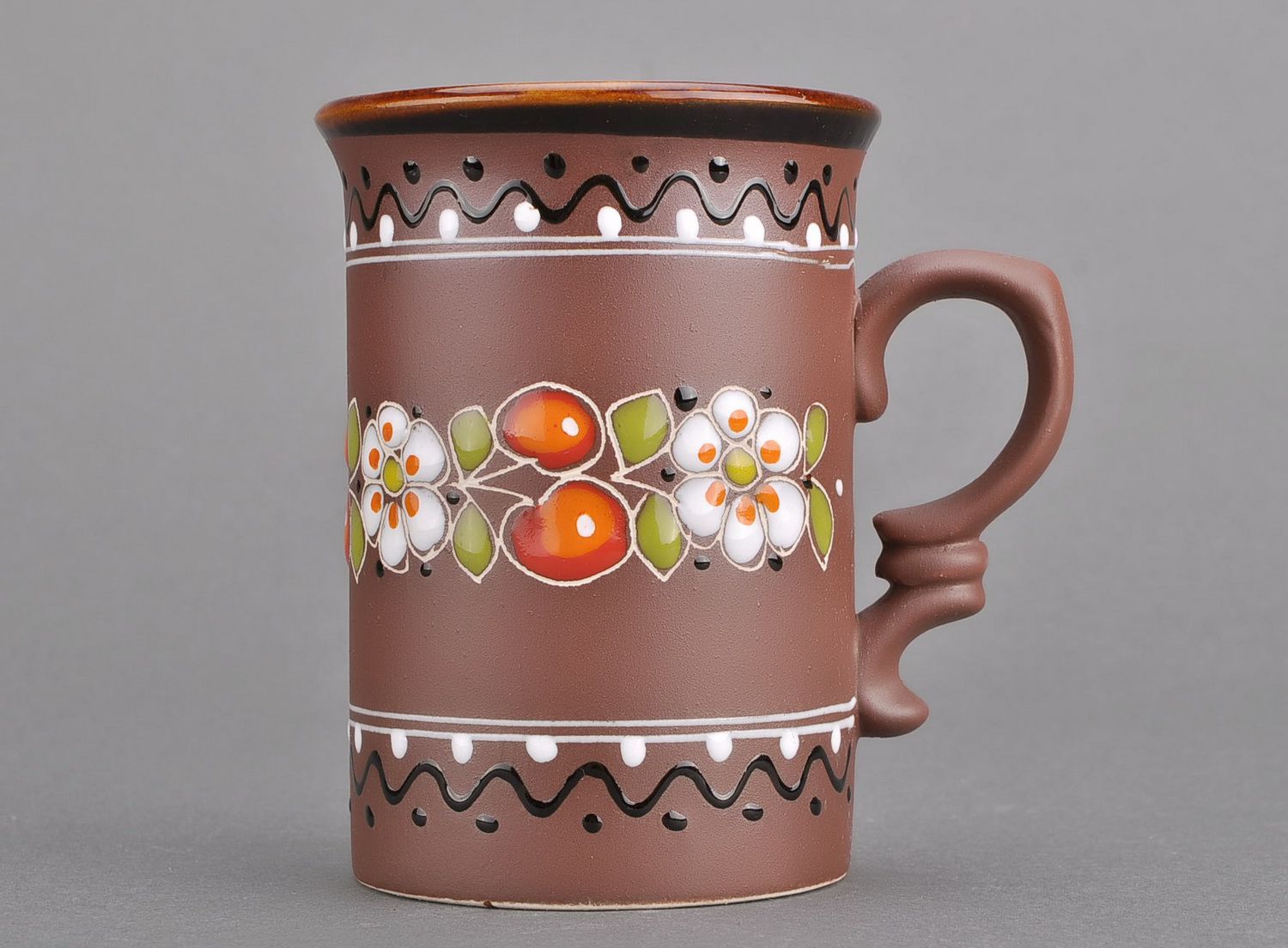 Tall decorative 8 oz glazed cup in brown color with floral design and handle photo 2