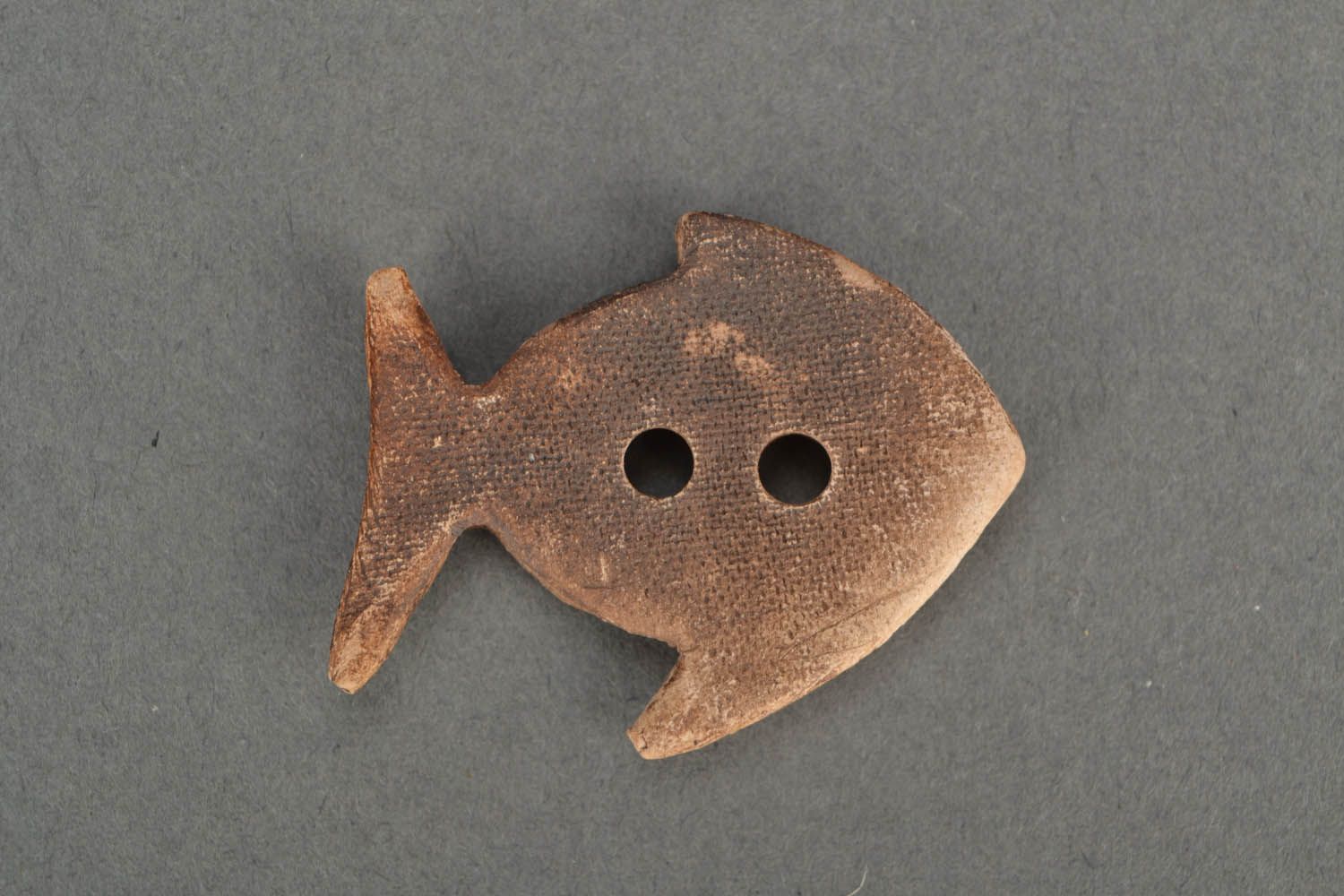 Clay button in the shape of the fish photo 4