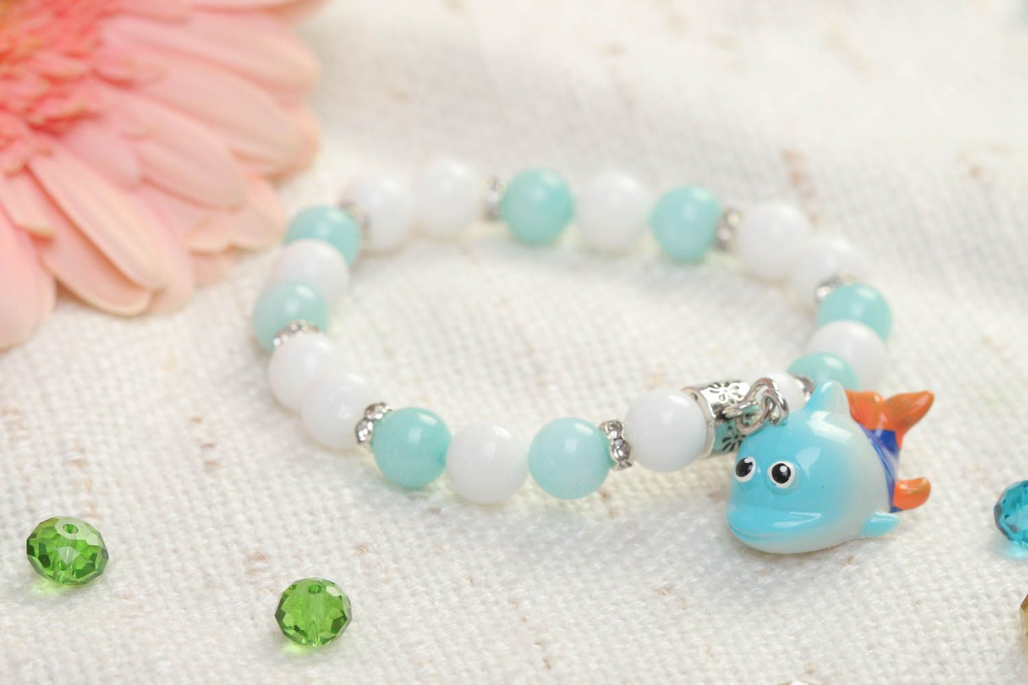 Turquoise and white beads elastic kids' bracelet with little wale charm  photo 1