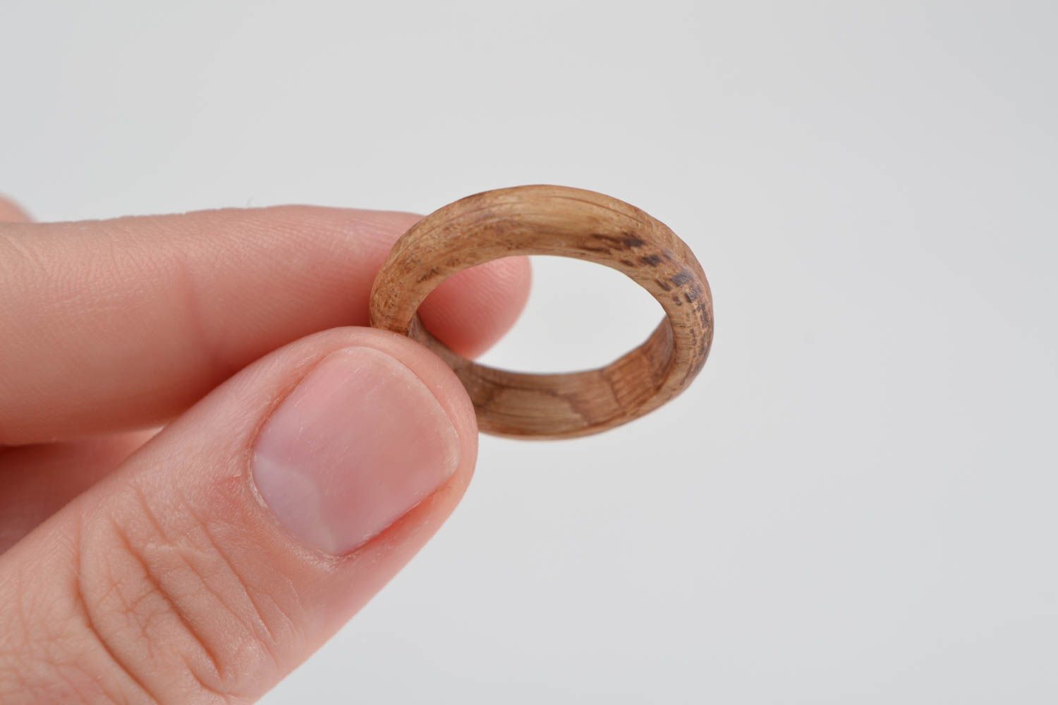 Simple handmade jewelry ring carved of natural oak wood of laconic design photo 2