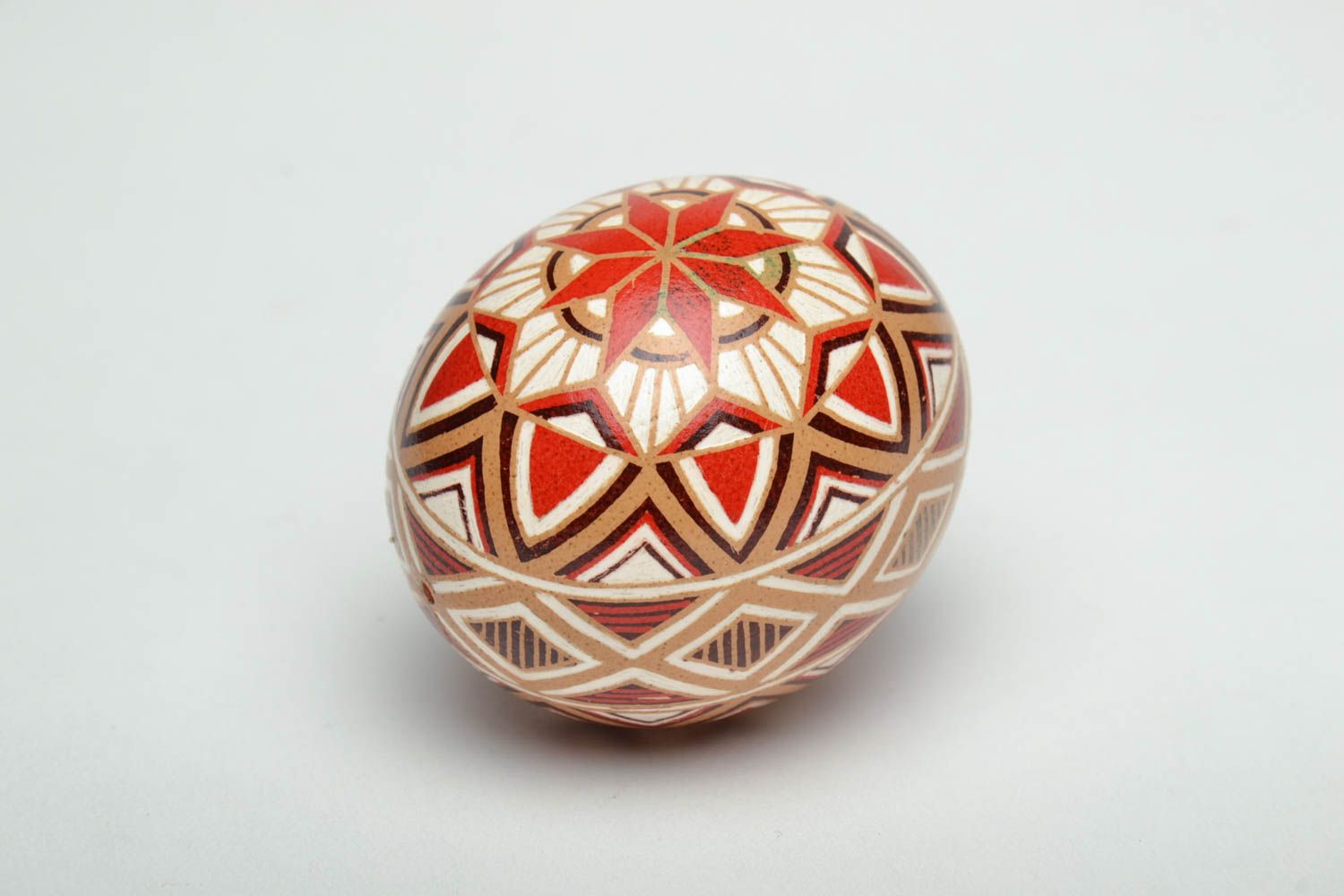 Handmade pysanka painted with hot wax with traditional symbols photo 4