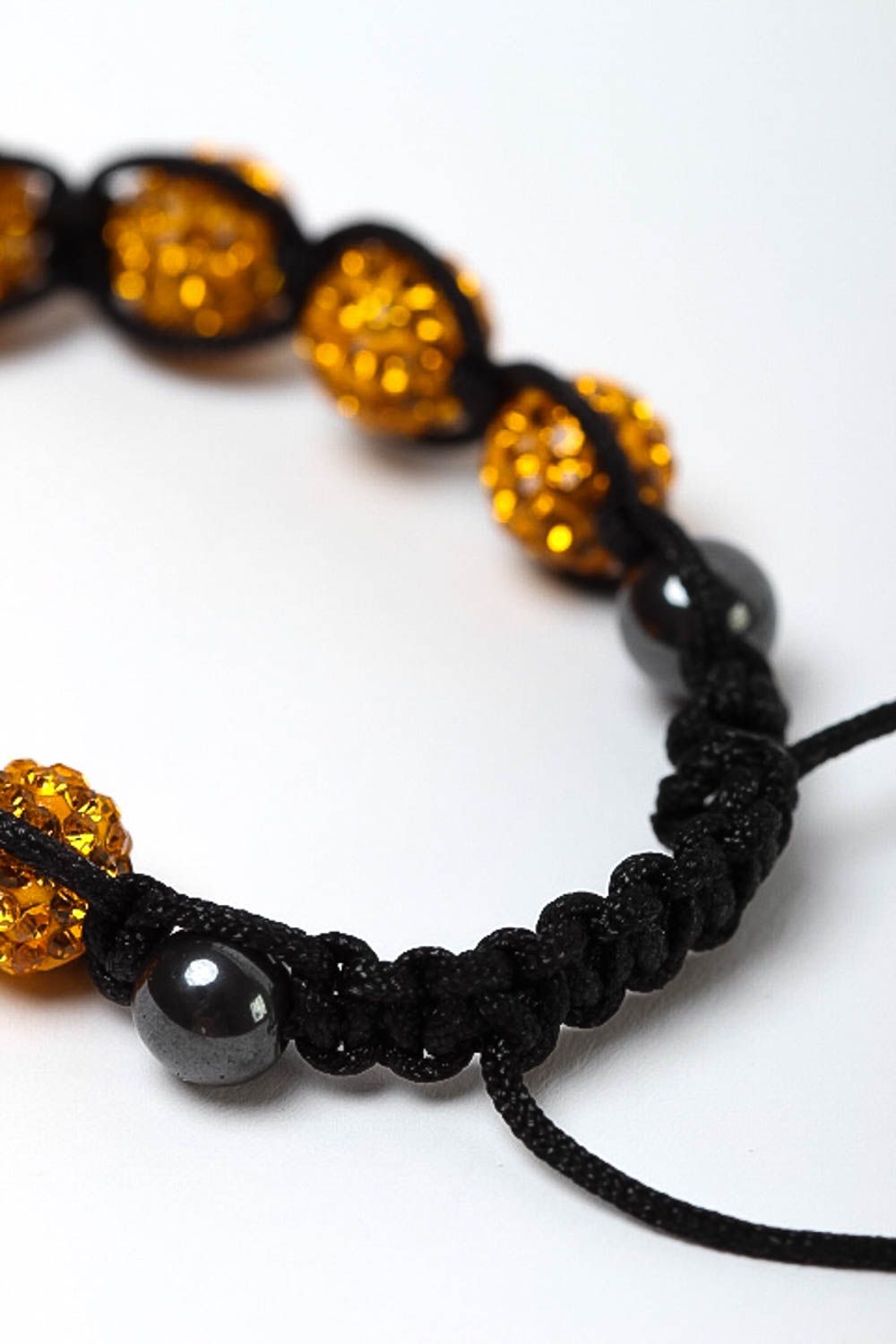 Gold color beads bracelet on the black rope for women photo 4