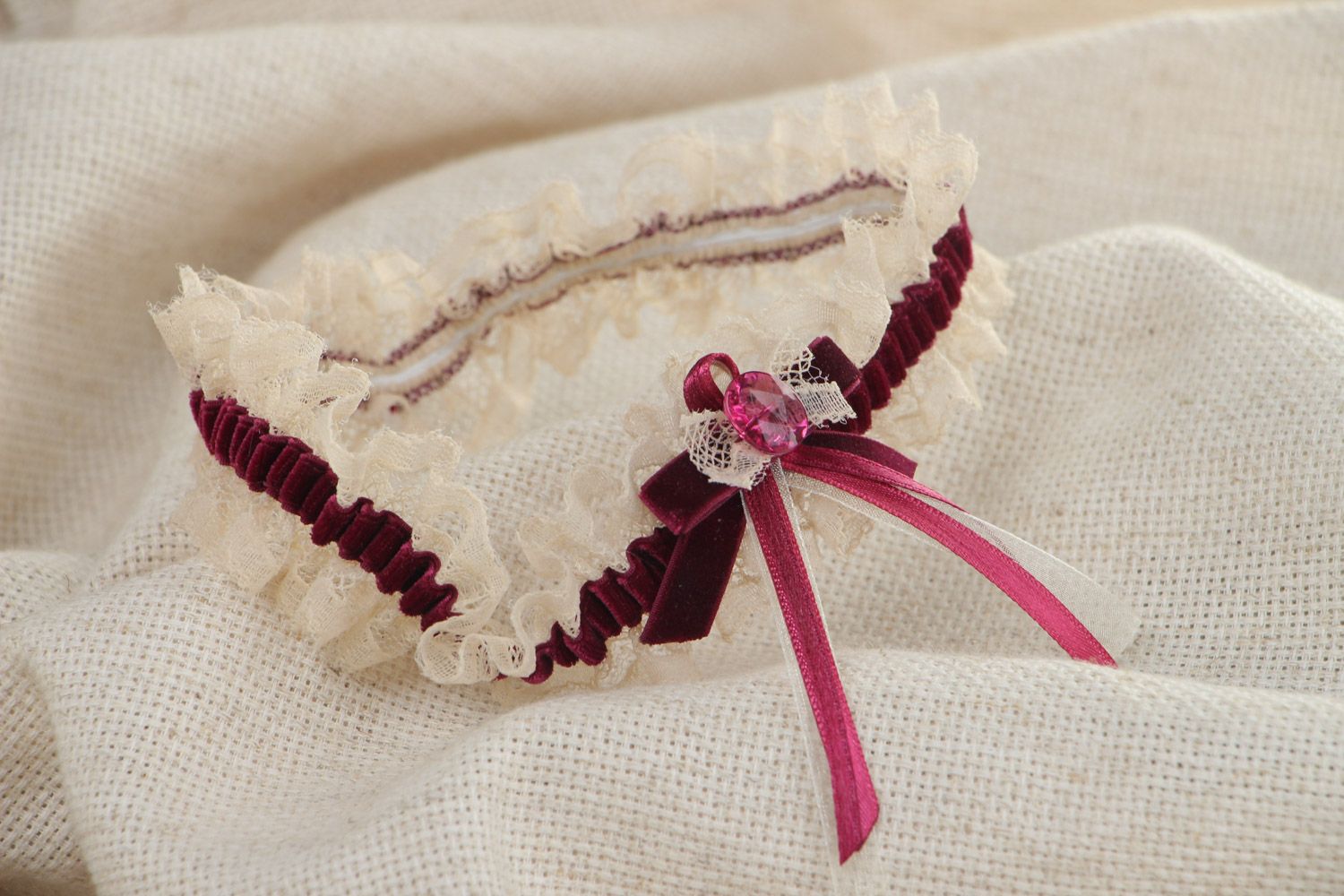 Handmade wedding bridal garter with lace and velor bow of dark violet color photo 1
