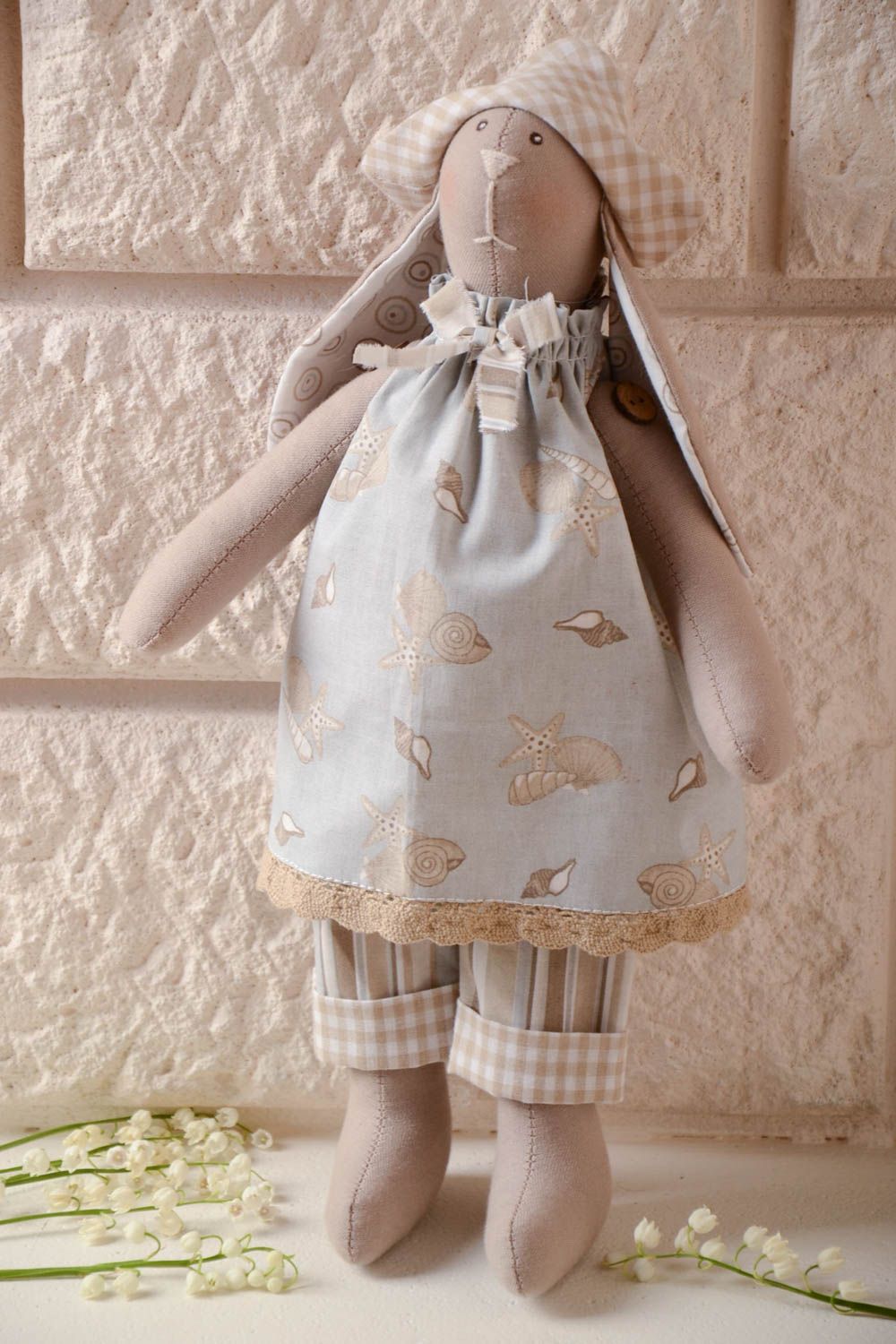 Handmade soft toy sewn of cotton fabric rabbit with long ears in hat and dress photo 1