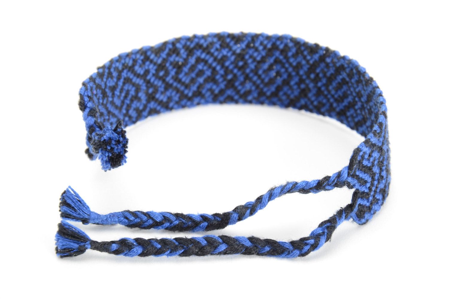Handmade friendship bracelet woven of threads with blue and black ornament  photo 3