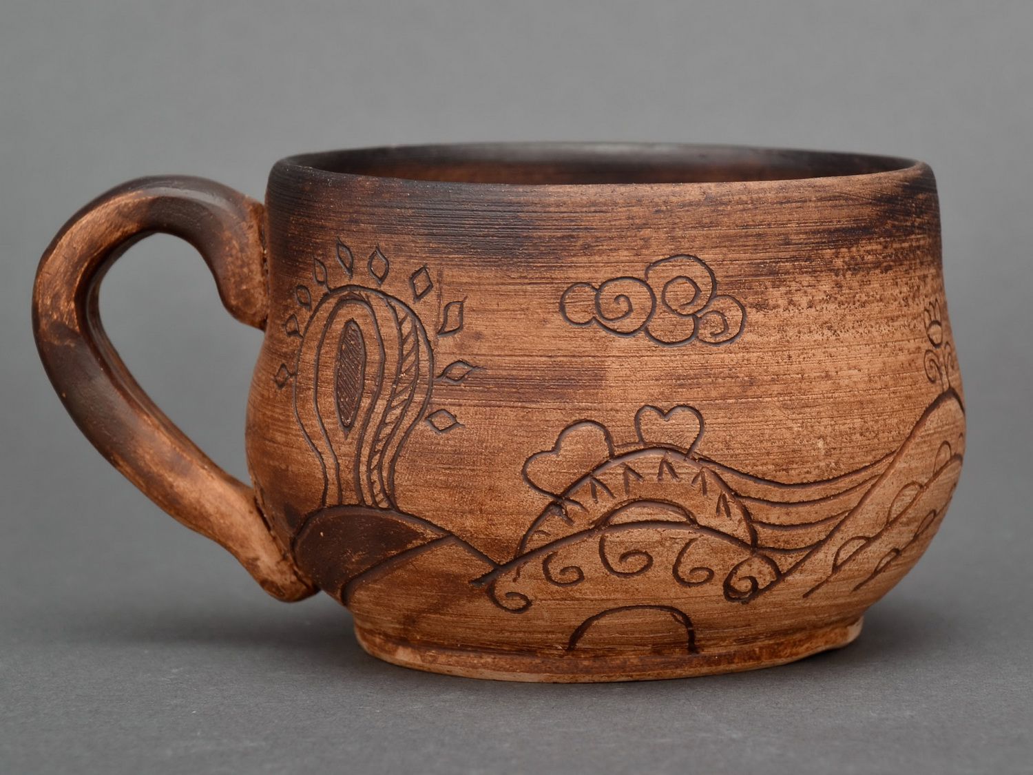 Red clay no glazed coffee cup, 8 oz, with handle and cave drawings photo 3