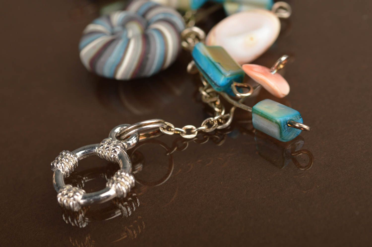 Handmade bracelet made of polymer clay on chain decorated with striped shells photo 5