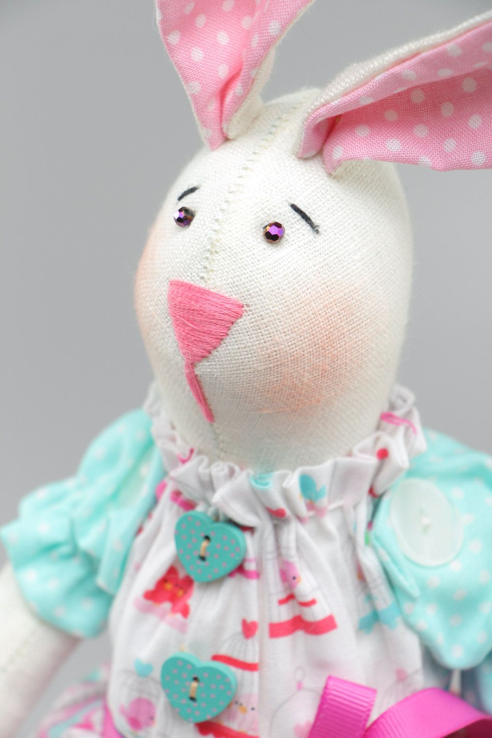 Cute handmade soft toy sewn of natural fabrics Rabbit with pink ears and dress photo 3
