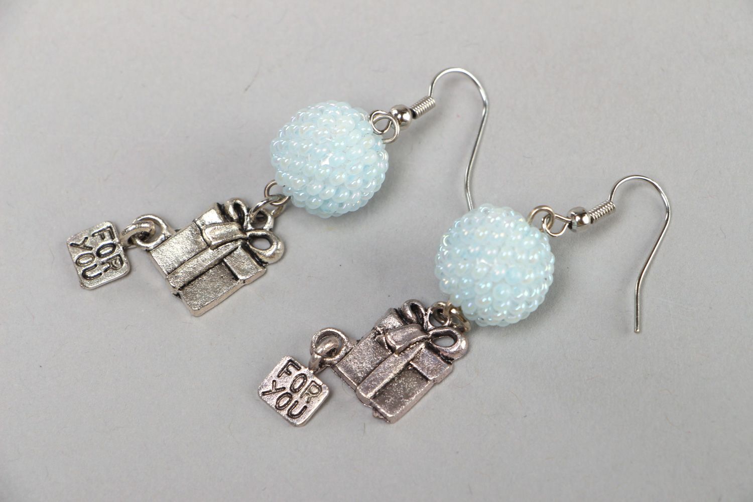 Handmade dangle beaded earrings with metal elements in tender color palette photo 1