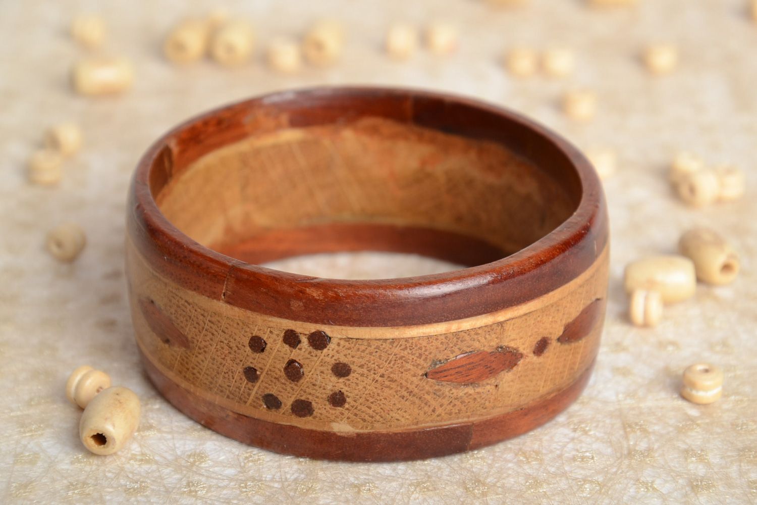 Handmade wrist bracelet carved of wood with inlay tinted and coated with varnish photo 2