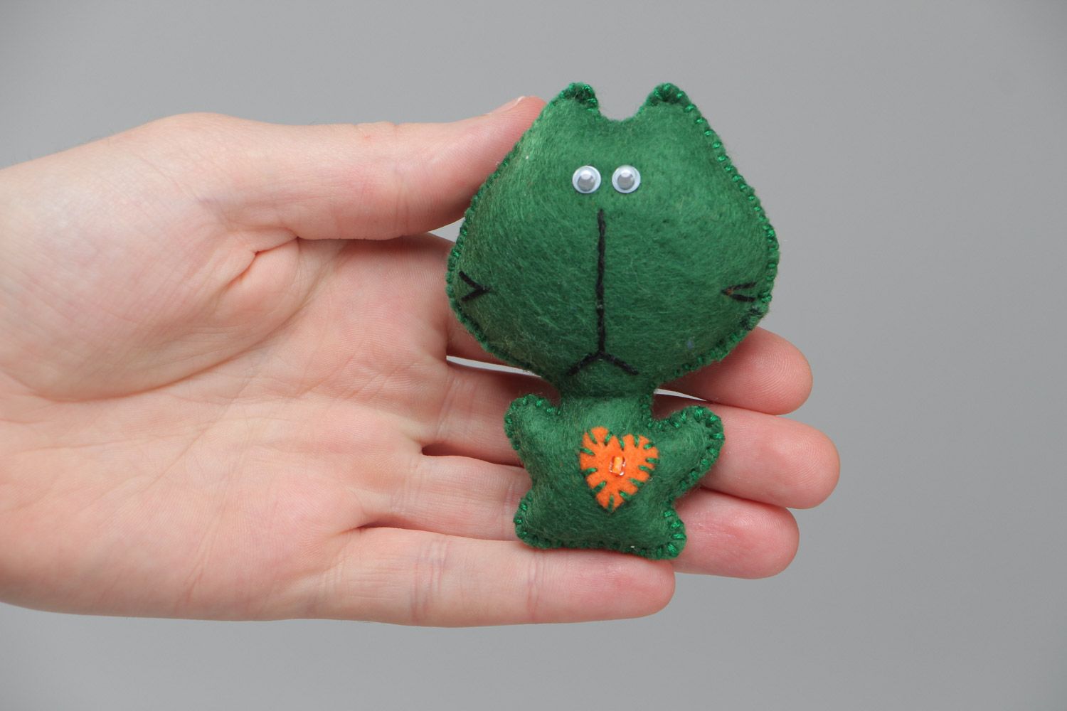 Small handmade soft toy sewn of felt funny green kitten with applique work photo 5