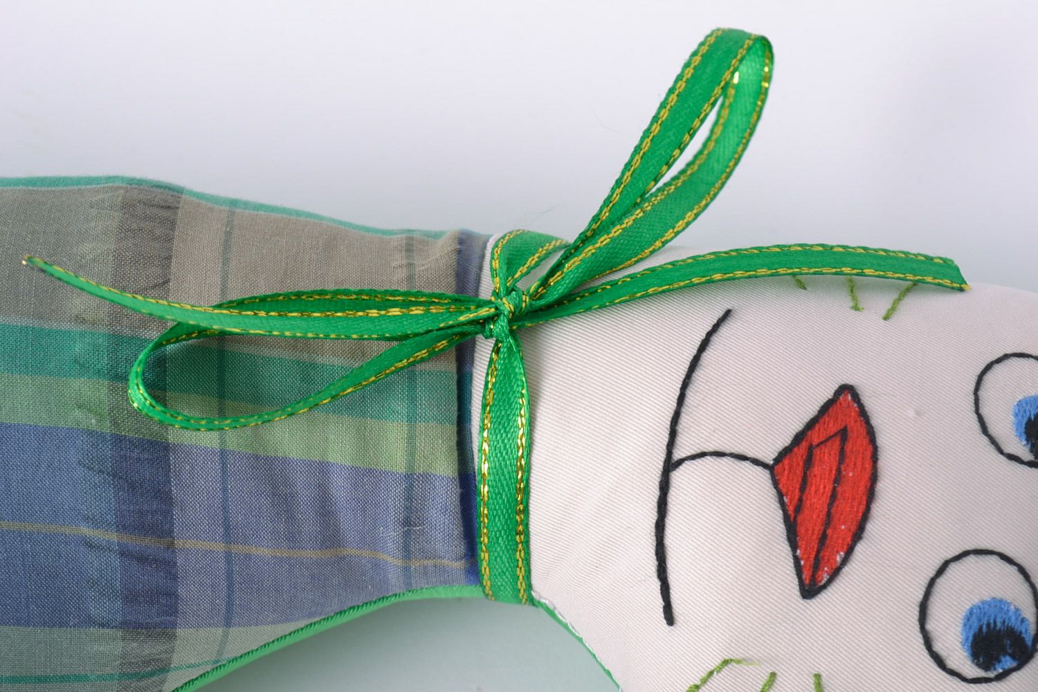 Handmade designer soft toy cat sewn of checkered fabric with green bow  photo 4