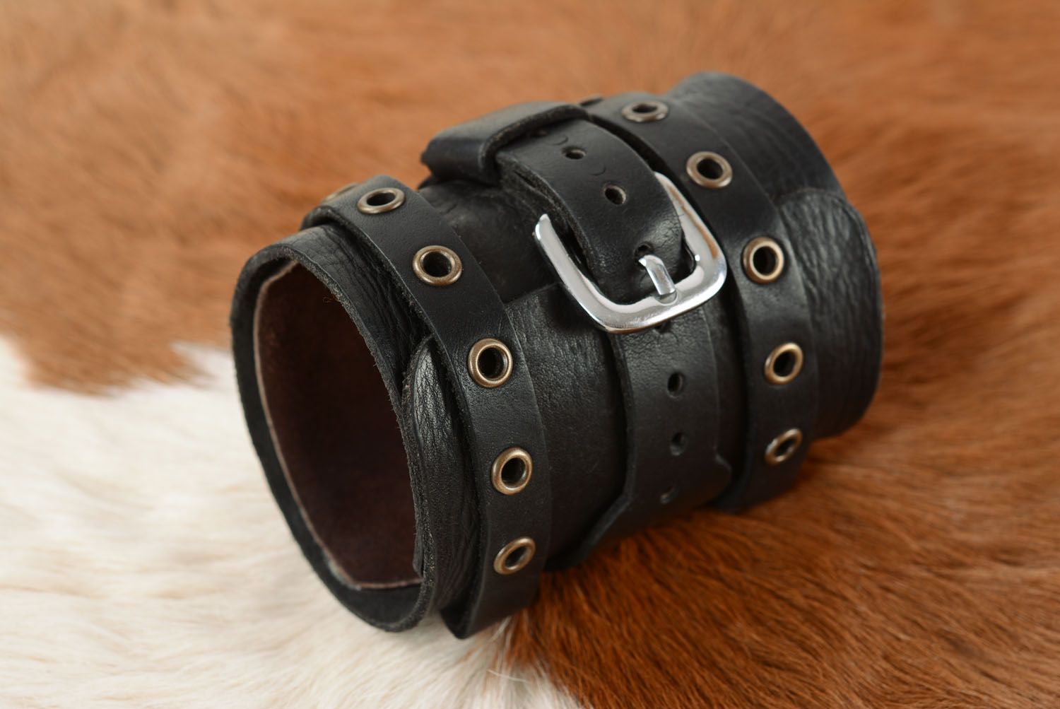 Leather bracelet with metal inserts photo 1